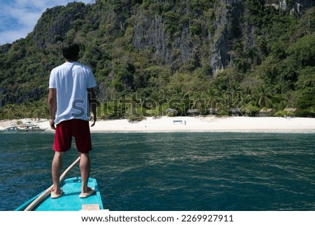 Approaching Black Island in Coron island, Palawan, Philippines Royalty-Free Stock Photo #2269927911