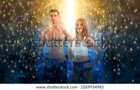 Fit couple at the gym. Fitness concept. Healthy life style. Sports wall paper for fitness gym advertising. Picture for a sports article in a magazine, website.
