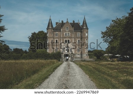 A French chateau with a gravel path leading to the door Royalty-Free Stock Photo #2269947869