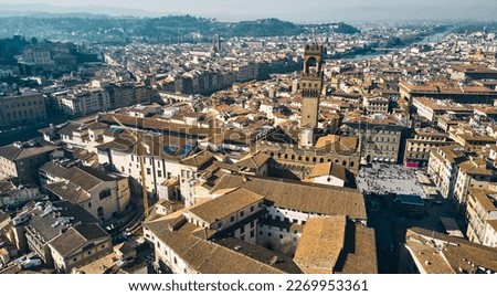 Aerial view of famous tower and Palazzo Vecchio square and Florence cityscape, Italy. High quality photo