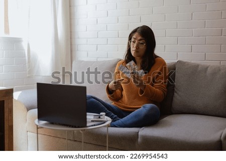 Latina woman receives medical consultation by video call. Illness and treatment concept. Home health care and telehealth