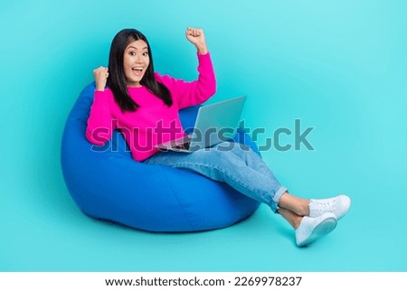Full length photo of lucky lady wear sweater bean bag online sale modern device empty space isolated turquoise color background Royalty-Free Stock Photo #2269978237