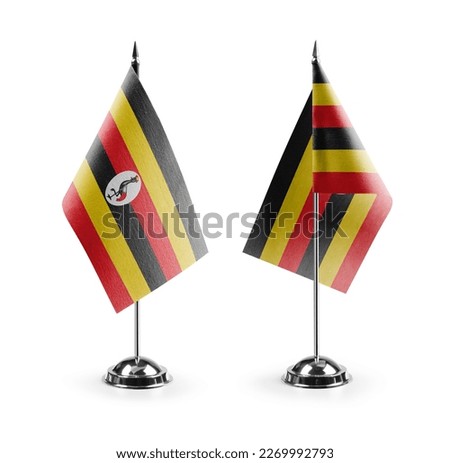 Small national flags of the Uganda on a white background. Royalty-Free Stock Photo #2269992793