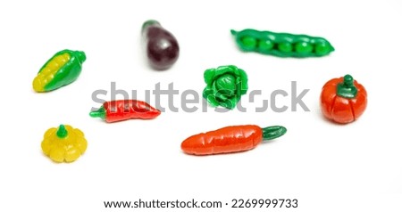 Colorful plasticine vegetable isolated on white background. Creative Handmade vegetables.