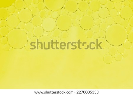 Background from bubbles of oil or fat. Bubble on yellow background