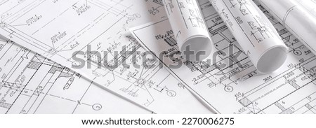 Architects concept, engineer architect designer freelance work on start-up project drawing, construction plan architect design working drawing sketch plans blueprints and making construction model Royalty-Free Stock Photo #2270006275