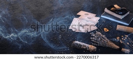 Tarot, astrology,Esoteric, Occult mystical ritual scene of sorcery tarot candles,dried flowers, palo santo tarot cards, ritual book.Witchcraft,mysticism and occultism,esoteric background,tarot banner Royalty-Free Stock Photo #2270006317