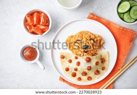 Omurice in the form of sleeping bear in a plate. toning. selective focus