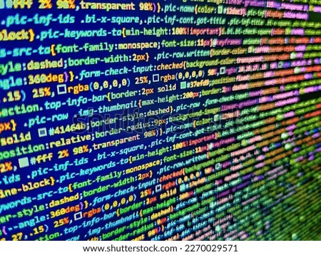 Website HTML Code on the Laptop Display Closeup Photo. Abstract technological background with digits and lines. Javascript lines of code into a library for website application