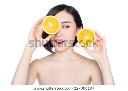 young woman with oranges in her hands, white background
