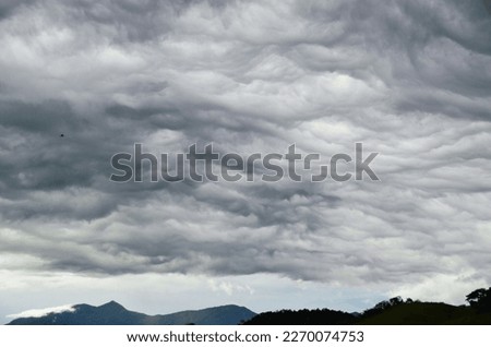 Spooky Nimbostratus clouds in the sky Royalty-Free Stock Photo #2270074753
