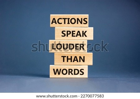 Actions speak louder words symbol. Concept words Actions speak louder than words on wooden blocks. Beautiful grey table grey background. Business new mindset for results concept. Copy space.