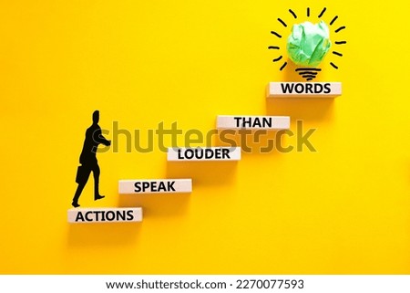 Actions speak louder words symbol. Concept words Actions speak louder than words on wooden blocks. Beautiful yellow table yellow background. Business new mindset for results concept. Copy space.