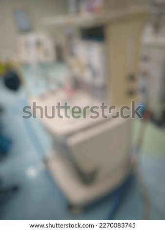 Defocused abstract background of anesthesia machine in operating theatre
