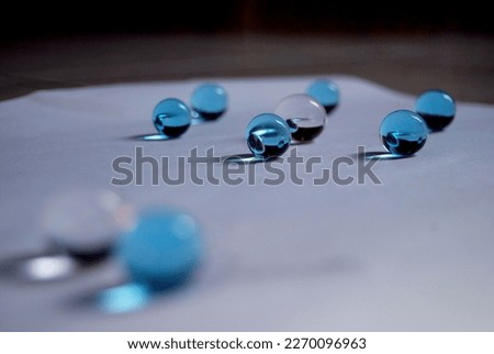 water blue gel balls.Polymer gel.Silica gelBalls of blue hydrogel.Crystal liquid ball with reflection. Close up macro Royalty-Free Stock Photo #2270096963