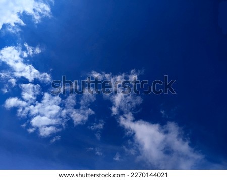 Dark blue Sky clouds background a sunny day