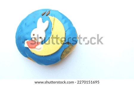 picture of a delicious round donuts rabbit with  
sugar glaze isolated on a white  background.homemade bakery concept and snacks and drinks .