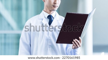 Honest Japanese male doctor portrait
