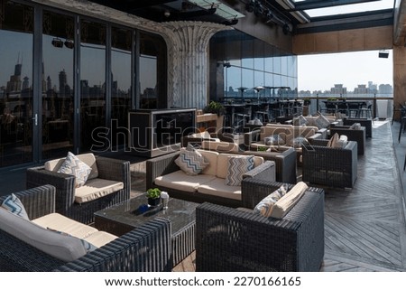 Outdoor cafe with wooden floor and sofa