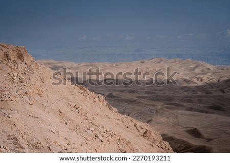Dead sea and Judean Desert view from the hill with Remains  of an ancient fortress Hyrcania, Khirbet el-Mird or Horcania. Royalty-Free Stock Photo #2270193211