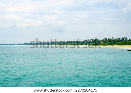 Beautiful tropical landscape. Sandy ocean shore. Beautiful texture background for tourism, design and advertising