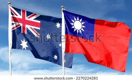 Australian flag and Taiwan flag on cloudy sky. waving in the sky