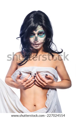 Beautiful woman with Sugar Skull Halloween makeup