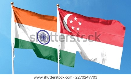 Singapore flag with Indian flag on cloudy sky. waving in the sky