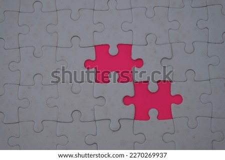 Missing place piece of white jigsaw puzzle to be finished. Selective focus