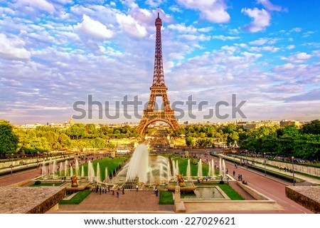 Eiffel Tower and fountain at Jardins du Trocadero at sunset in Paris, France. Travel background