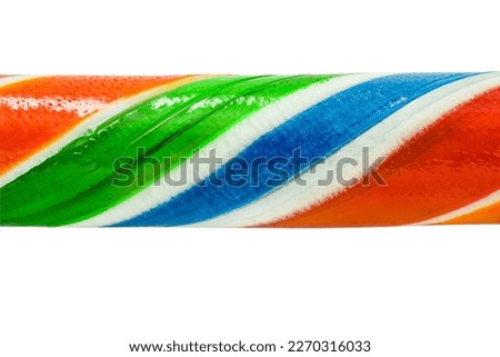 Multi colored Christmas candy cane, smooth part close-up, isolated on white background with clipping path
