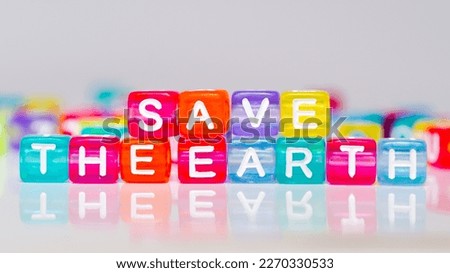 save the earth phrases in colorful blocks. words in colorful cubes. fun concept about caring for the earth, caring for and saving the earth from pollution.