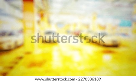 Blurred abstract background of Parking area inside supermarket at the night time