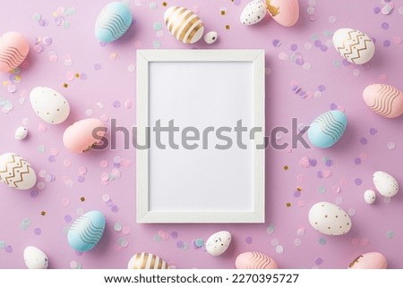 Easter concept. Top view photo of empty photo frame colorful easter eggs and confetti on isolated lilac background with copyspace