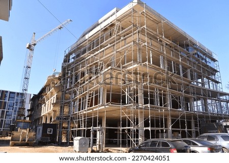 The construstion of a high-rise residential building is underway Royalty-Free Stock Photo #2270424051