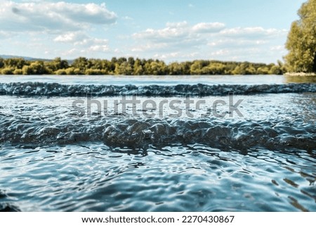 Low angle view of River Rhine with small wave near Ingelheim, Germany