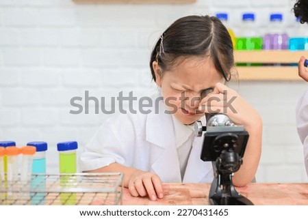 Back to school, Kids education knowledge, Child in classroom at school, Kid dressed Science lab coat. Science concept