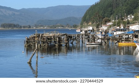 Fishermen's dock at the mouth of the Queule river on the Chilean Araucania Coast Royalty-Free Stock Photo #2270444529
