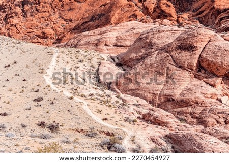 Steep hiking trail leading into the rugged wilderness of Red Rock Canyon in Las Vegas, Nevada provides access to leisure hikers and those who wish to participate in outdoor activities. Royalty-Free Stock Photo #2270454927