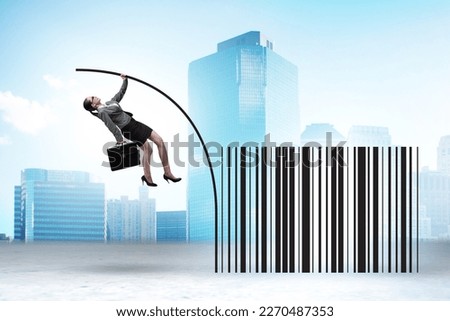 Businesswoman jumping over bar code in pole vaulting