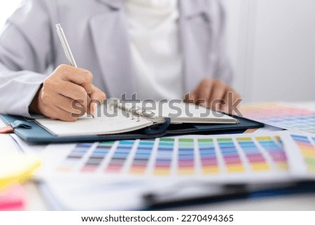 Businesswoman working and analyzing about color lab with color bar xample