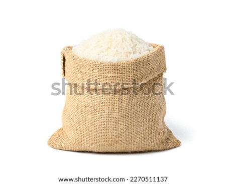  Jasmine rice in burlap sack bag isolated on white background. Royalty-Free Stock Photo #2270511137