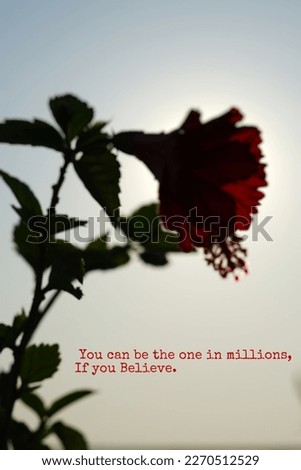 Motivation thought on blurred background flower image.