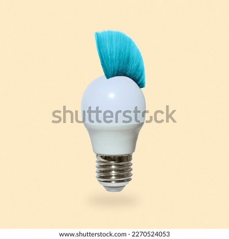 A daring playful electric light bulb with Mohawk hairstyle. Minimal concept of modern technology ideas and pop culture. High quality photo