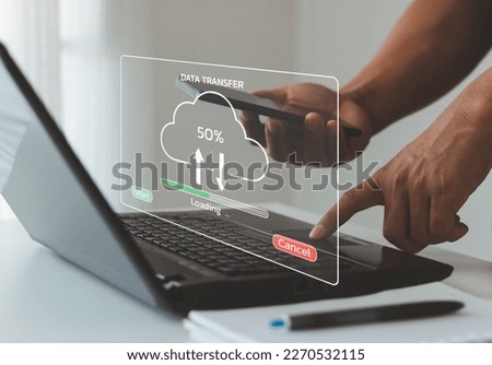 Data transfer, Uploading Upload and Download Information Concept. cloud uploading on a virtual screen. Users use laptops to transfer data and wait to load digital business data from websites.