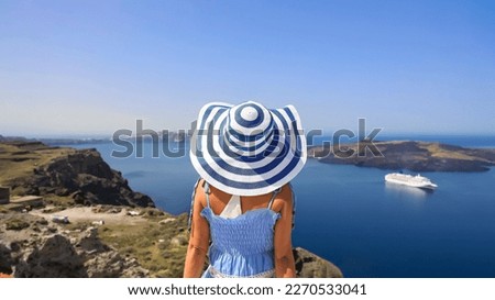 Back view of young woman happy as freedom lifestyle in Aegean sea mediterranean at Santorini,greece