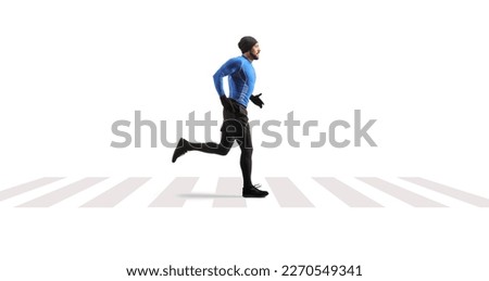 Male runner on a pedestrian crossing isolated on white background Royalty-Free Stock Photo #2270549341
