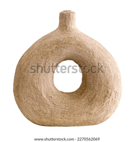 Clay beige round pot isolated on background. Elegant piece of handmade furniture in a rustic style. Still life with ceramic rounded vase for interior design. Donut-shaped vase. Jug like a torus Royalty-Free Stock Photo #2270562069