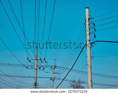 electric poles and wires on a blue background