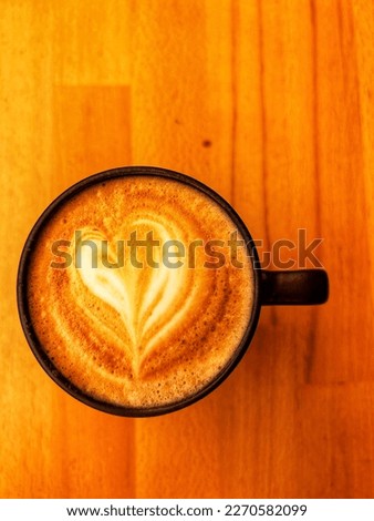 Top view of flat white coffee, heart picture coffee.